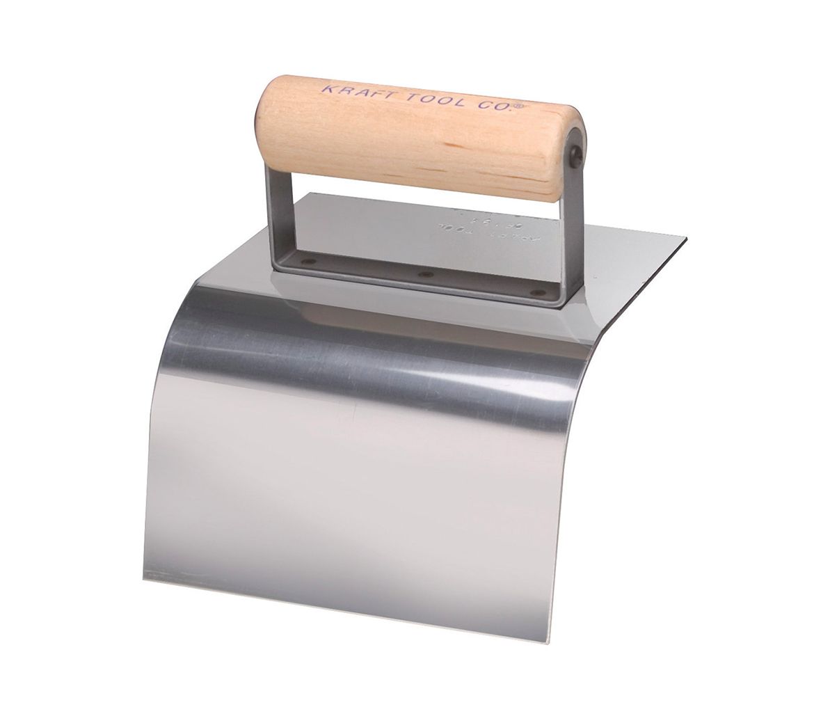 A stainless steel trowel with a wooden handle on a white background