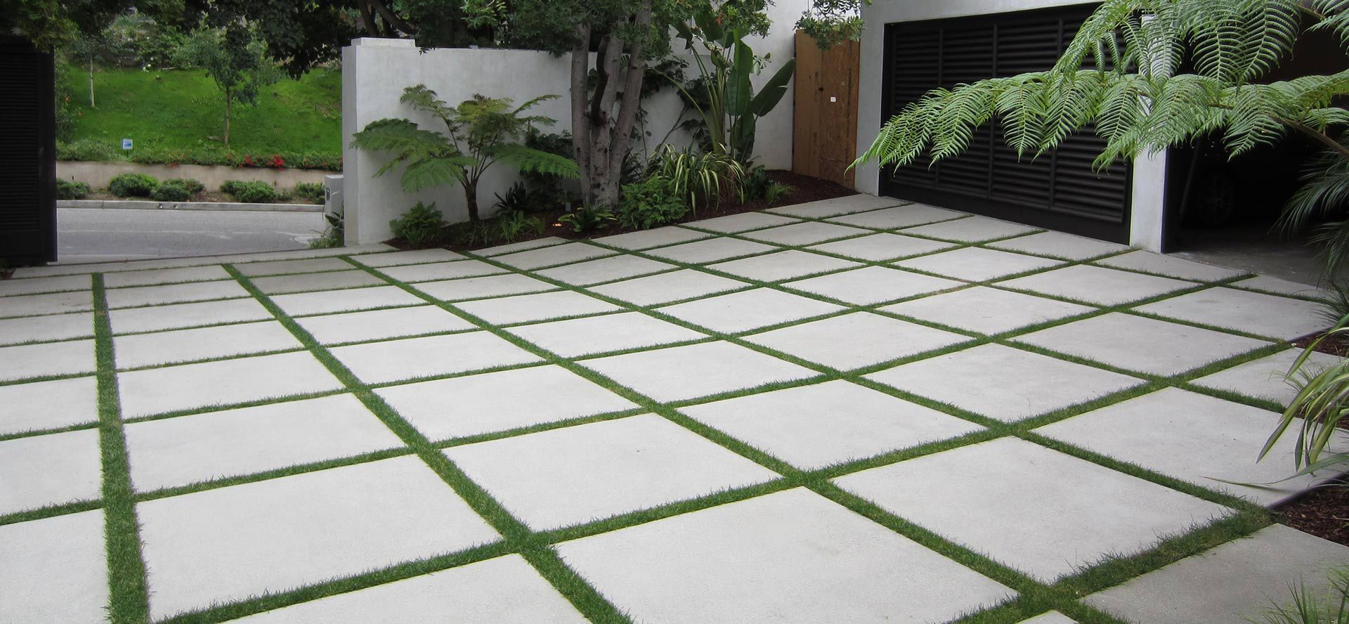 Waypoint Concrete installed a concrete paver grid system with grass infill for a backyard in Eagle, Idaho.