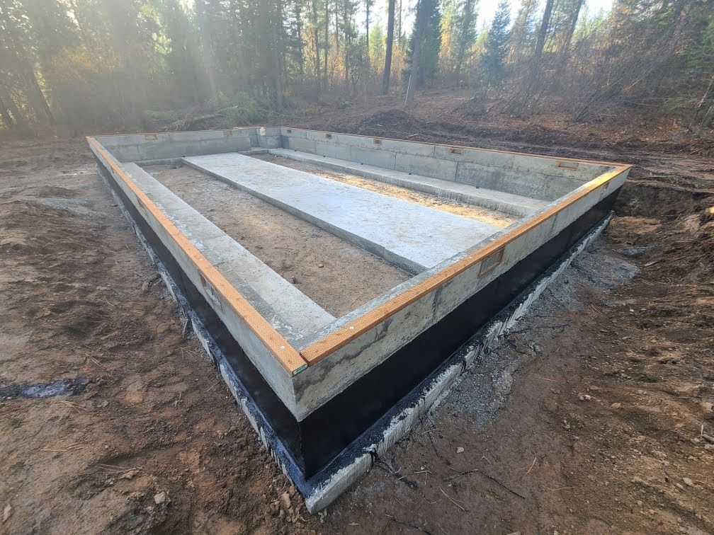 Waypoint Concrete formed a raised triangular planter with clean concrete finish in Hidden Springs, Idaho.