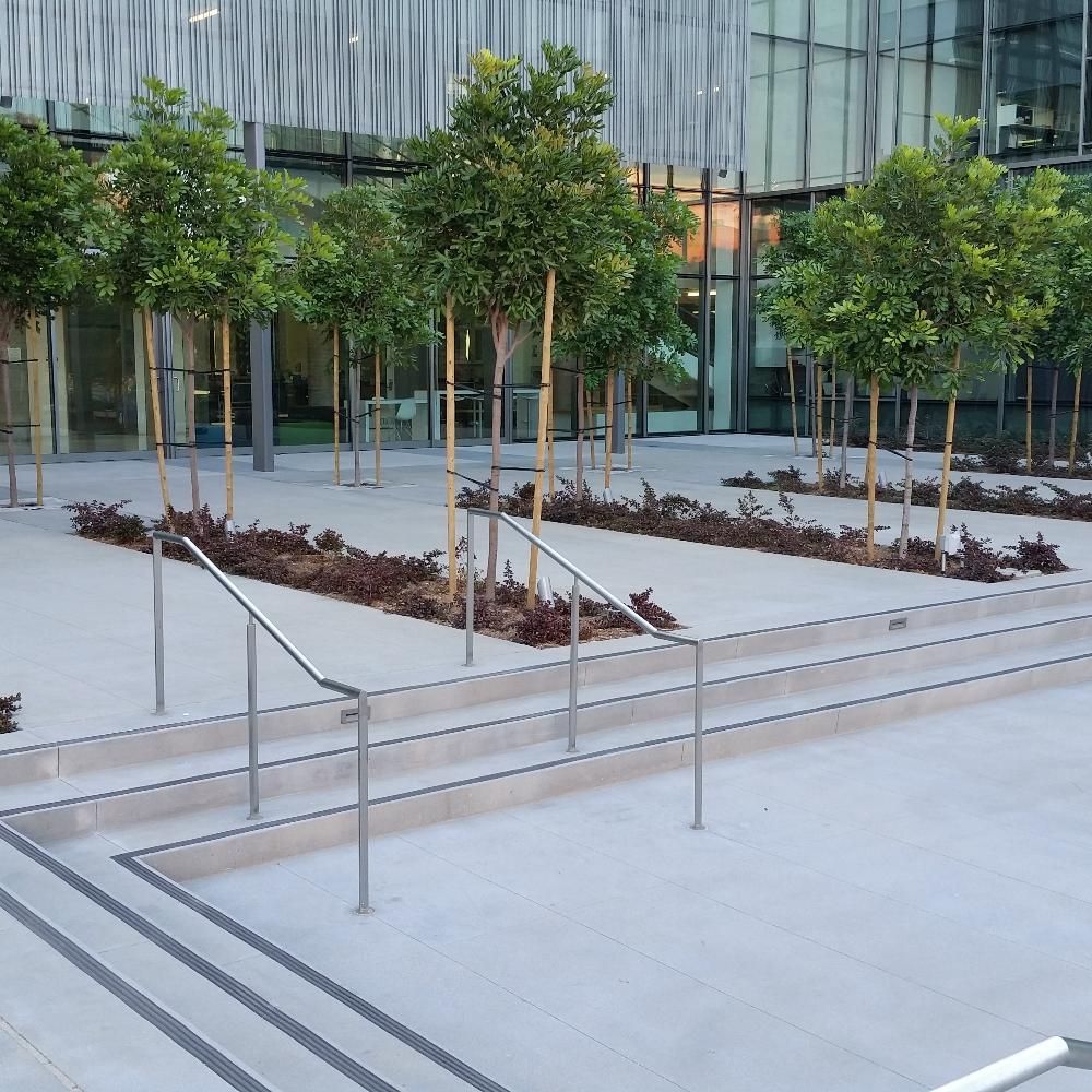 Waypoint Concrete installed a polished public plaza with integrated concrete planters in Boise, Idaho