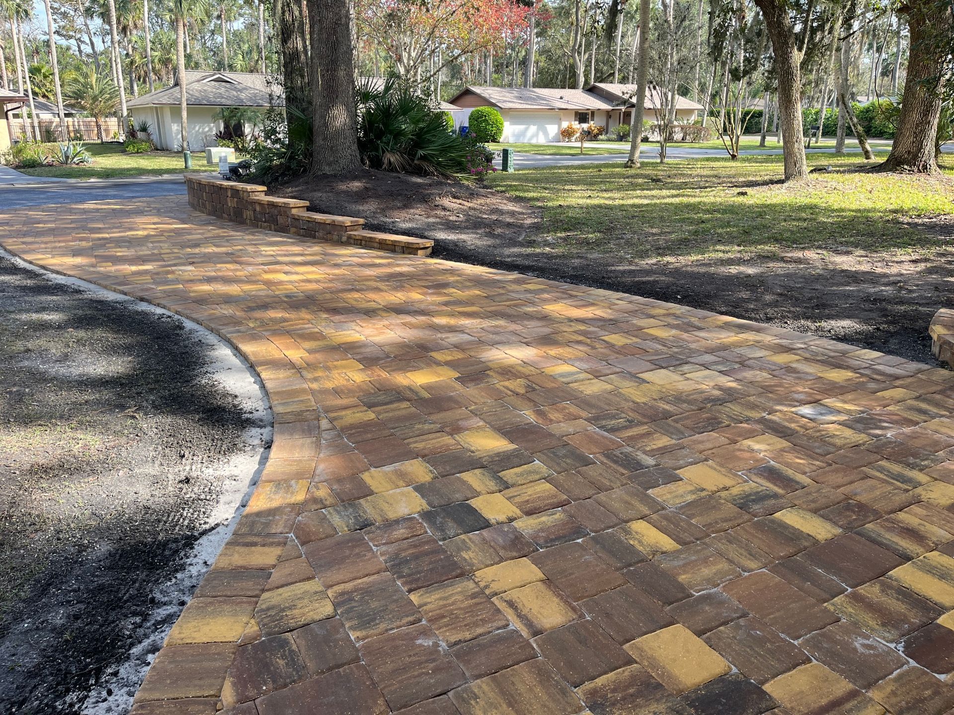 Waypoint Concrete installed a two-tone concrete paver driveway with accent borders in a rural lot near Kuna, Idaho.