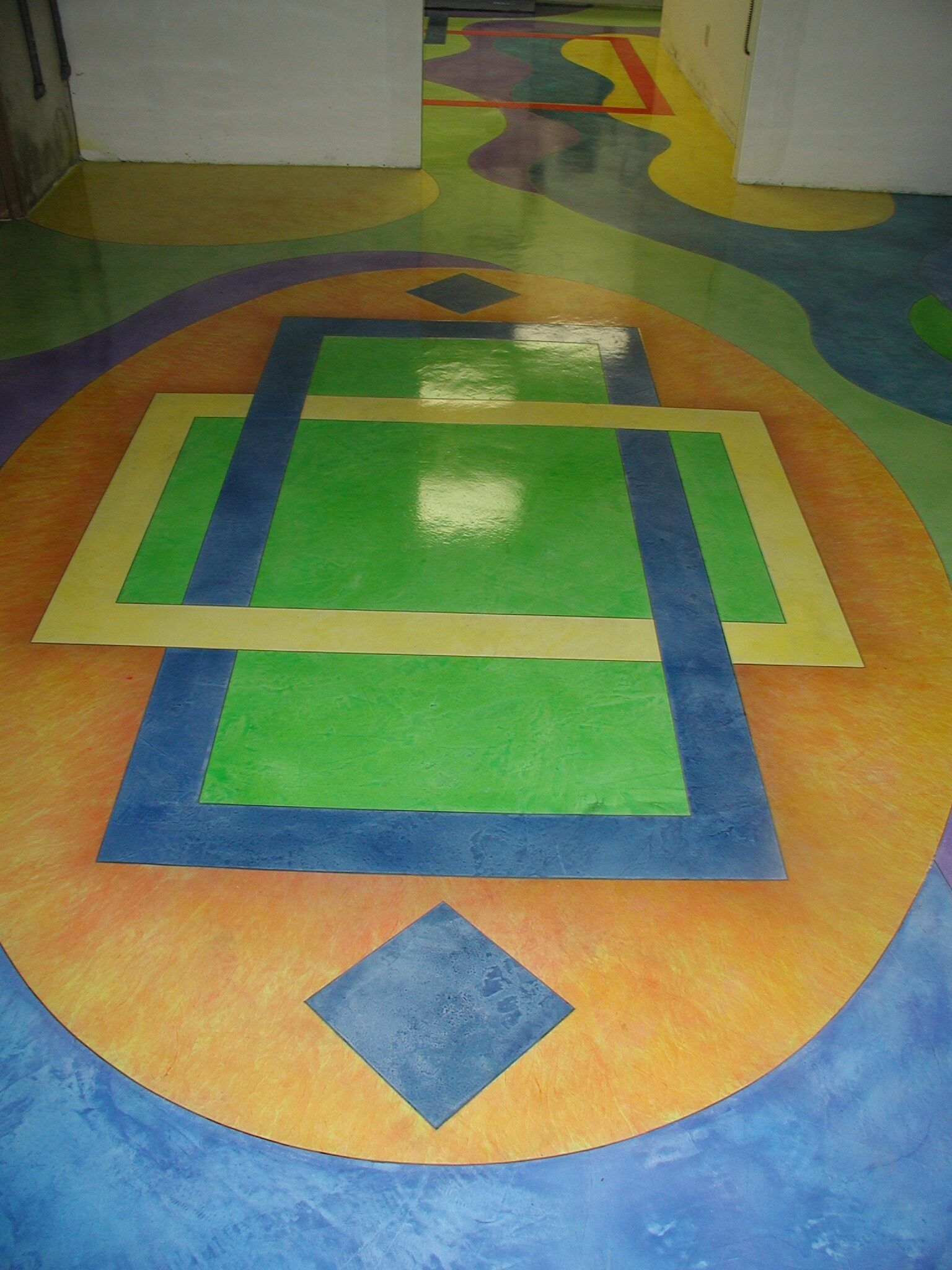 Waypoint Concrete created a geometric design using color additives in a residential floor in Nampa, Idaho.