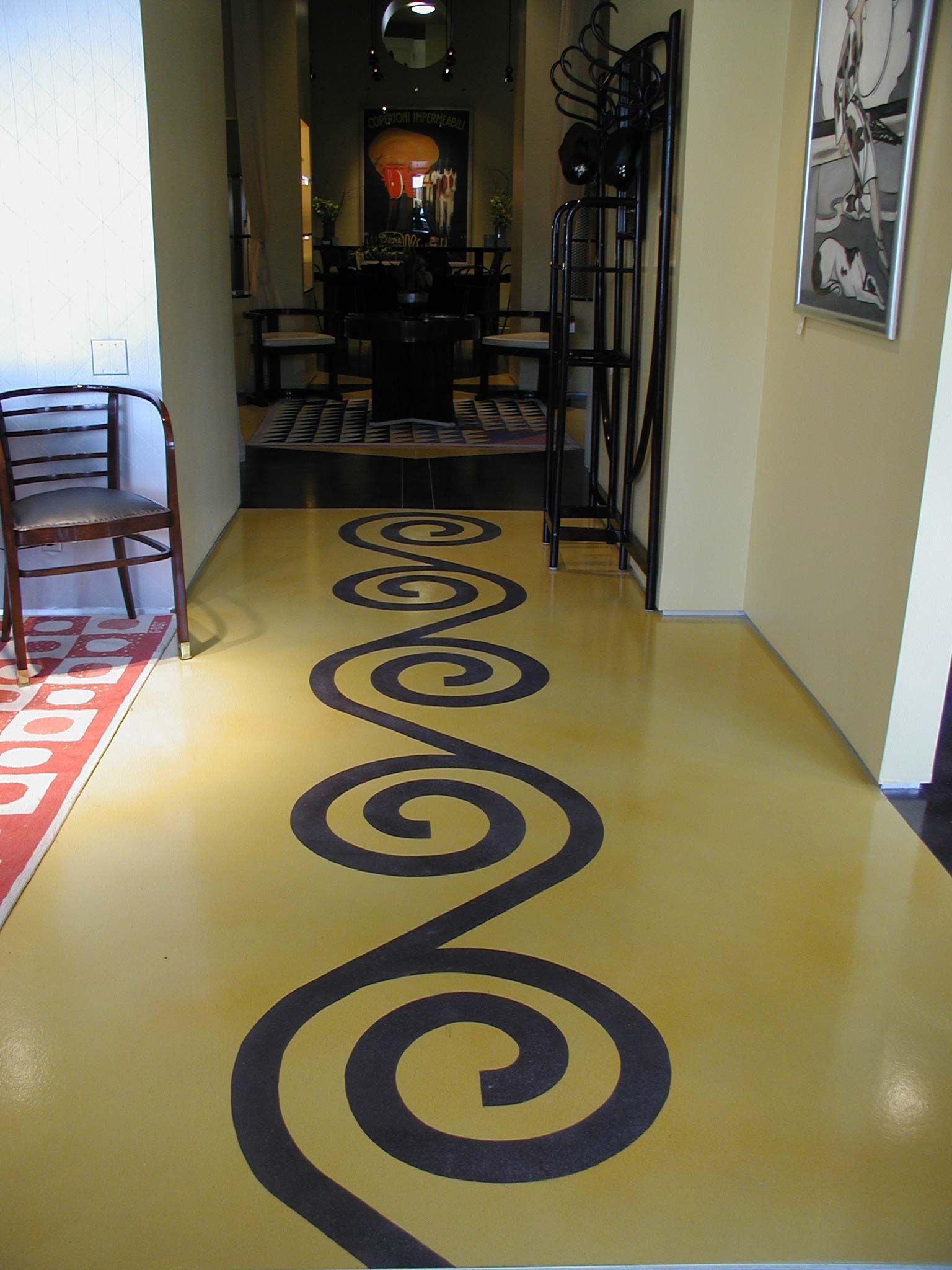 Waypoint Concrete finished a bright yellow concrete floor with black swirl design in a school in Boise, Idaho.