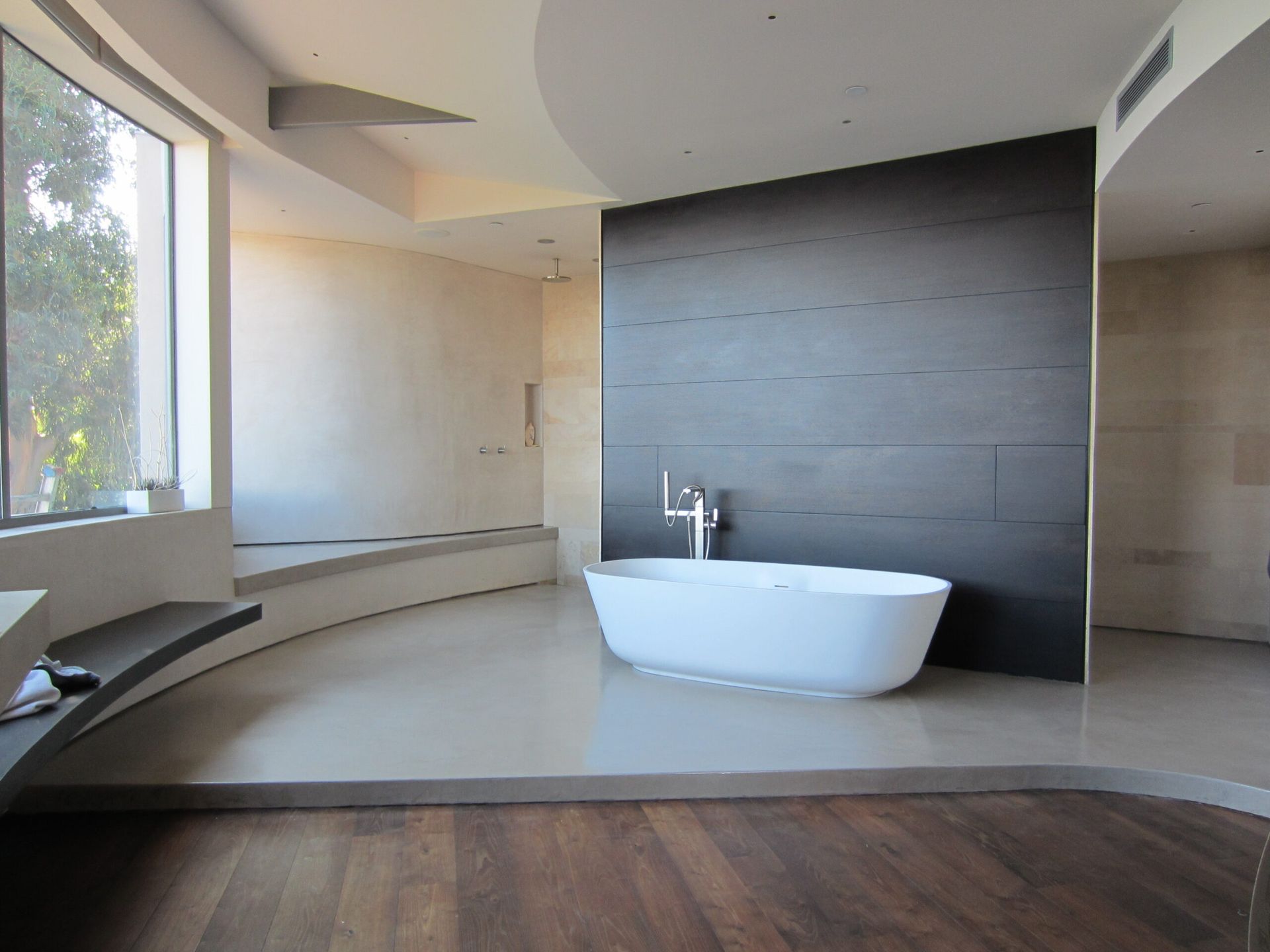 Waypoint Concrete poured and polished a decorative concrete floor for a contemporary bathroom in Horseshoe Bend.