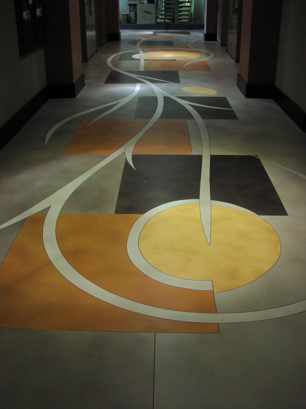 Waypoint Concrete created a decorative concrete floor with sweeping curved accents for a foyer in Emmett, Idaho.