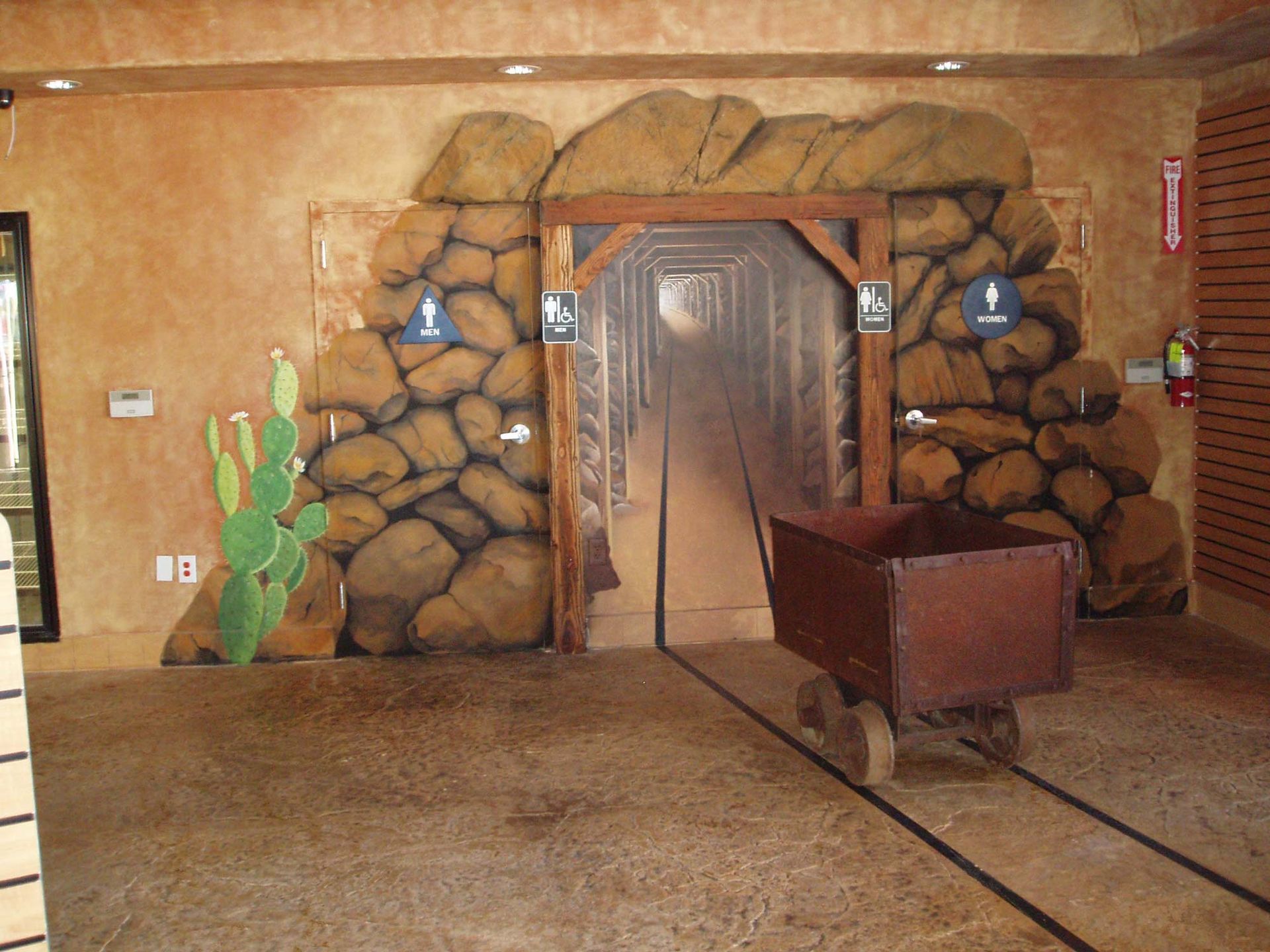 Waypoint Concrete installed a stained concrete floor with natural tones and rockwork accents in Cascade, Idaho.