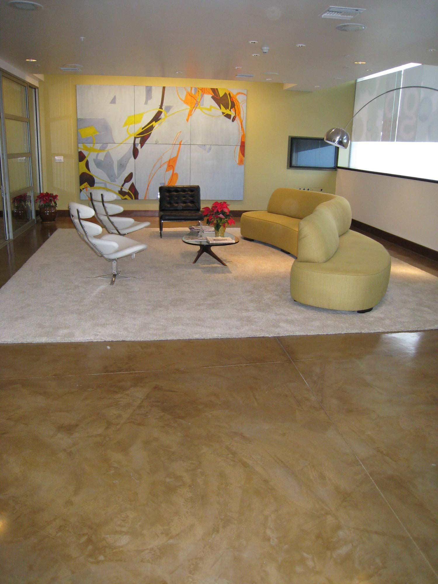 Waypoint Concrete finished a smooth decorative concrete floor for a modern lounge space in Parma, Idaho.