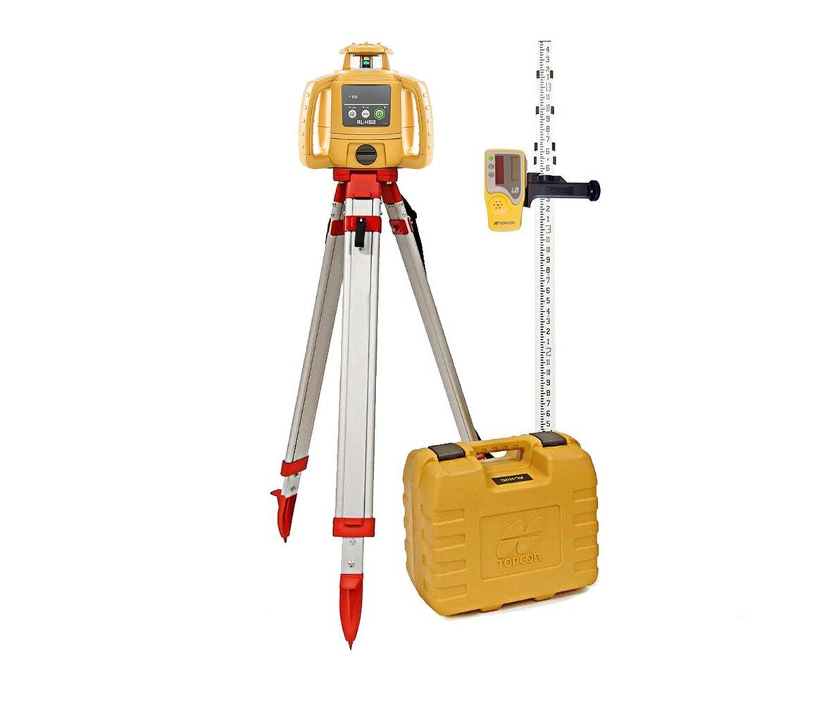 A laser level is sitting on top of a tripod.