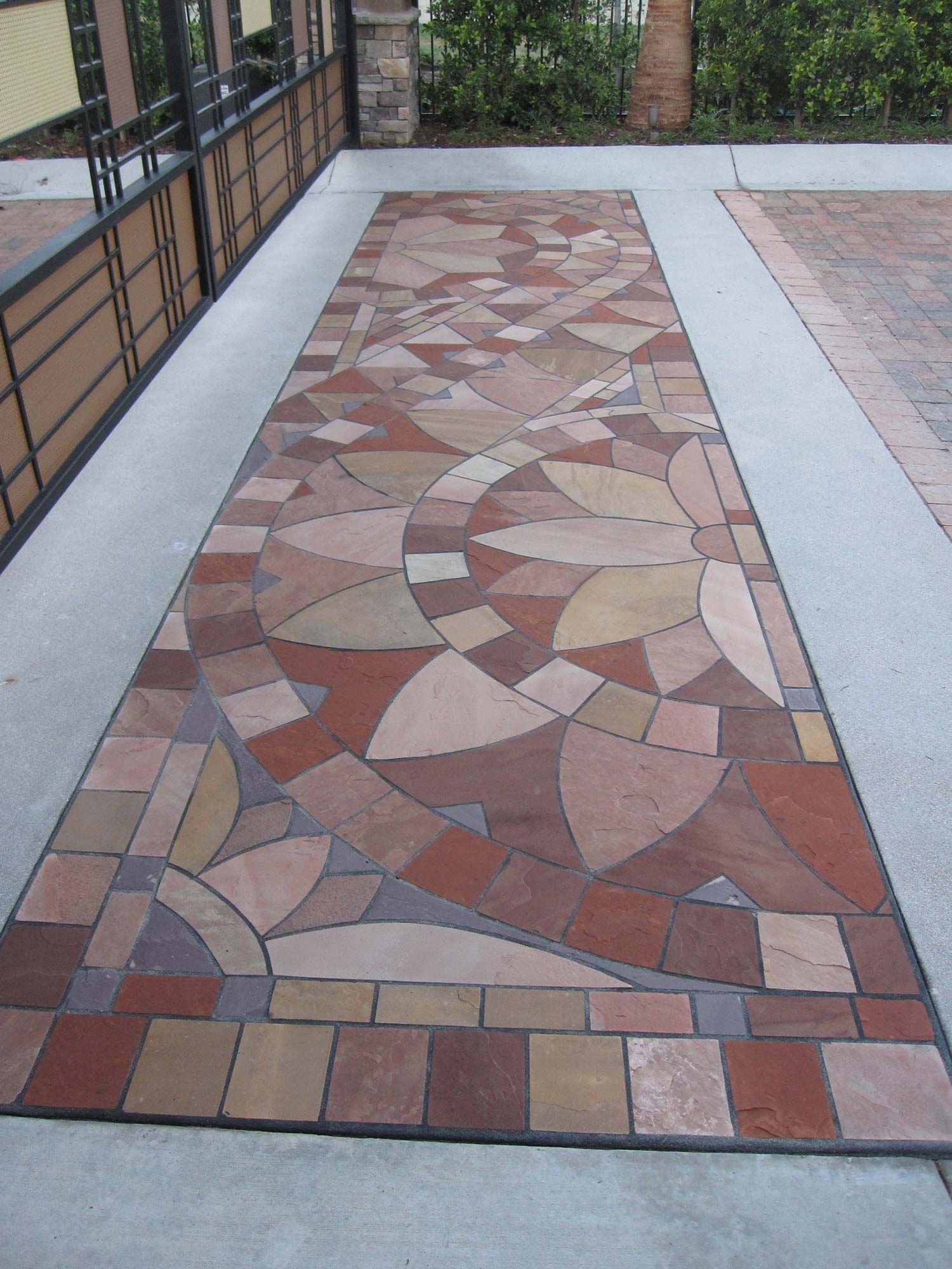 Waypoint Concrete installed a mosaic concrete sidewalk using recycled stone materials in Garden City, Idaho.