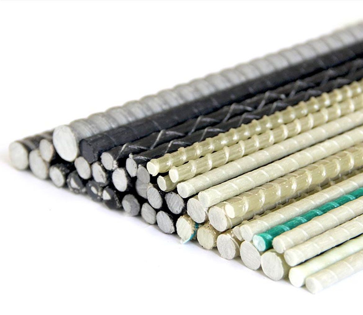 A bunch of different colored sticks are stacked on top of each other on a white surface.
