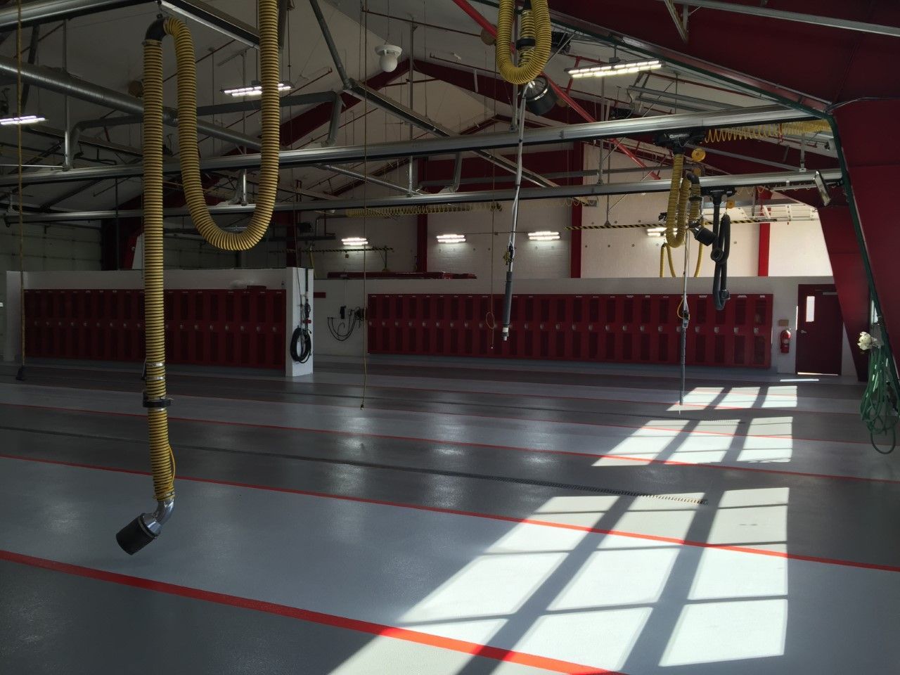 Waypoint Concrete installed an epoxy-coated commercial floor in a red-and-gray scheme in Boise, Idaho.