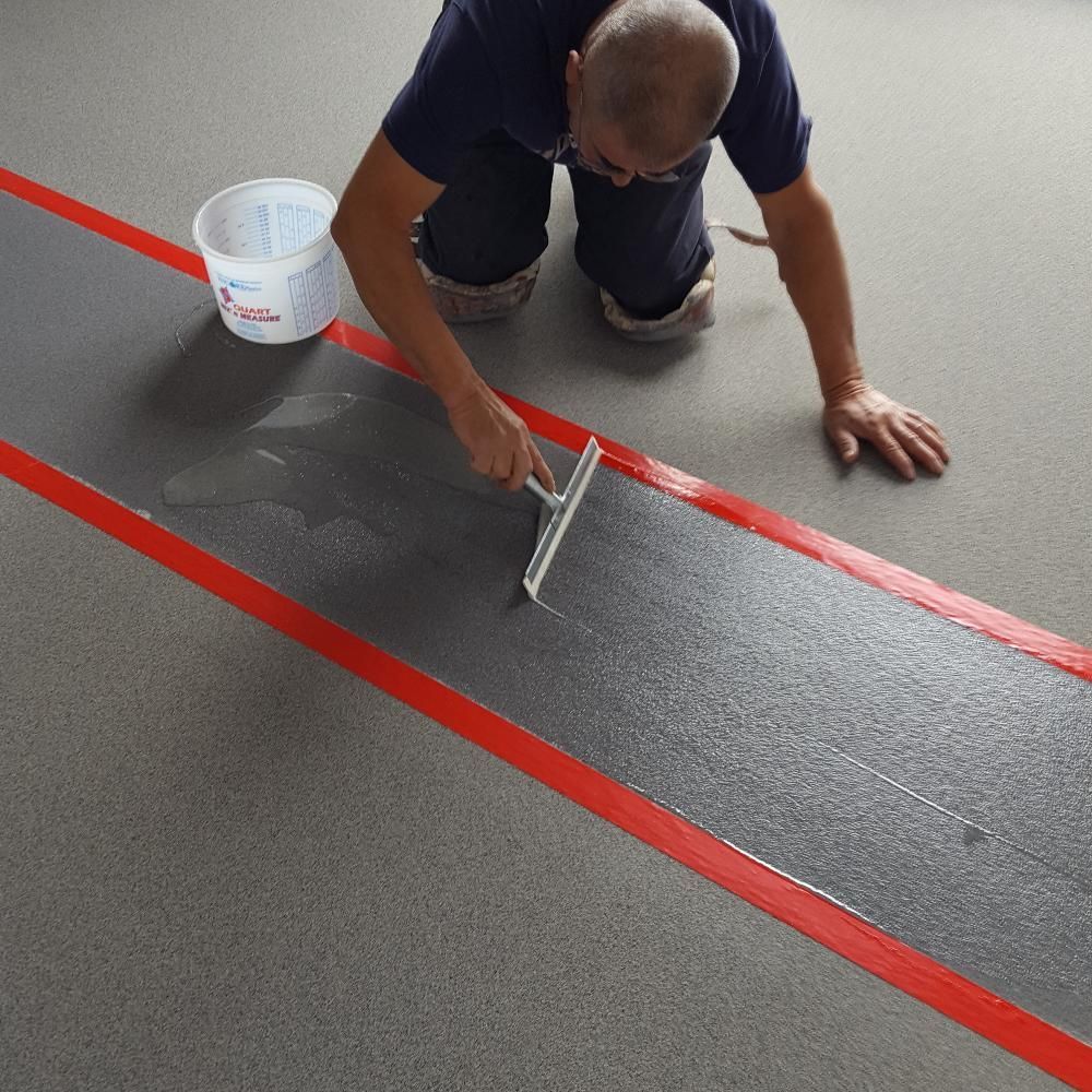 Waypoint Concrete applied high-durability epoxy striping on a concrete warehouse floor in Kuna, Idaho.