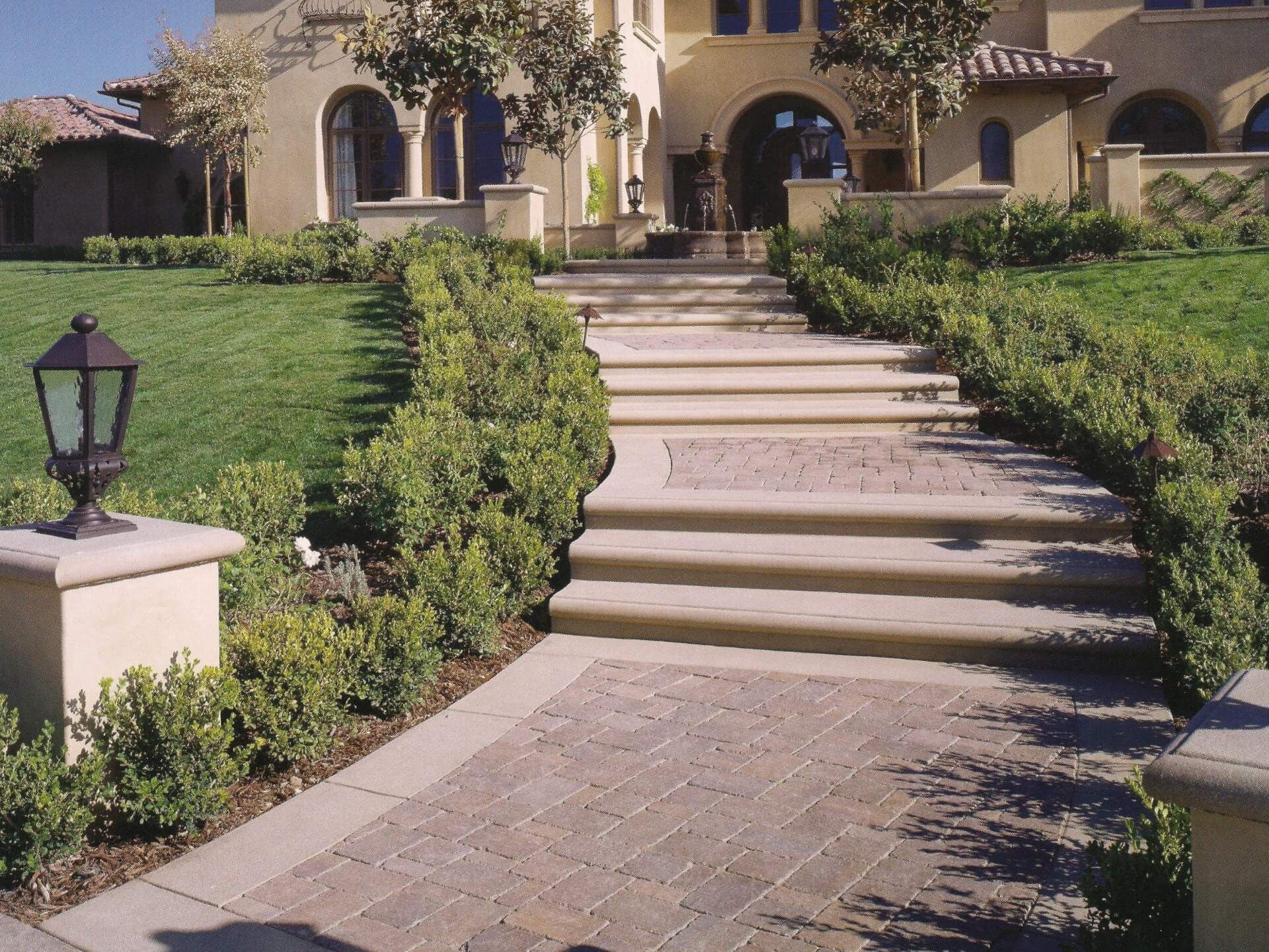 Waypoint Concrete built a wide decorative concrete stairway surrounded by landscape walls in Star, Idaho.