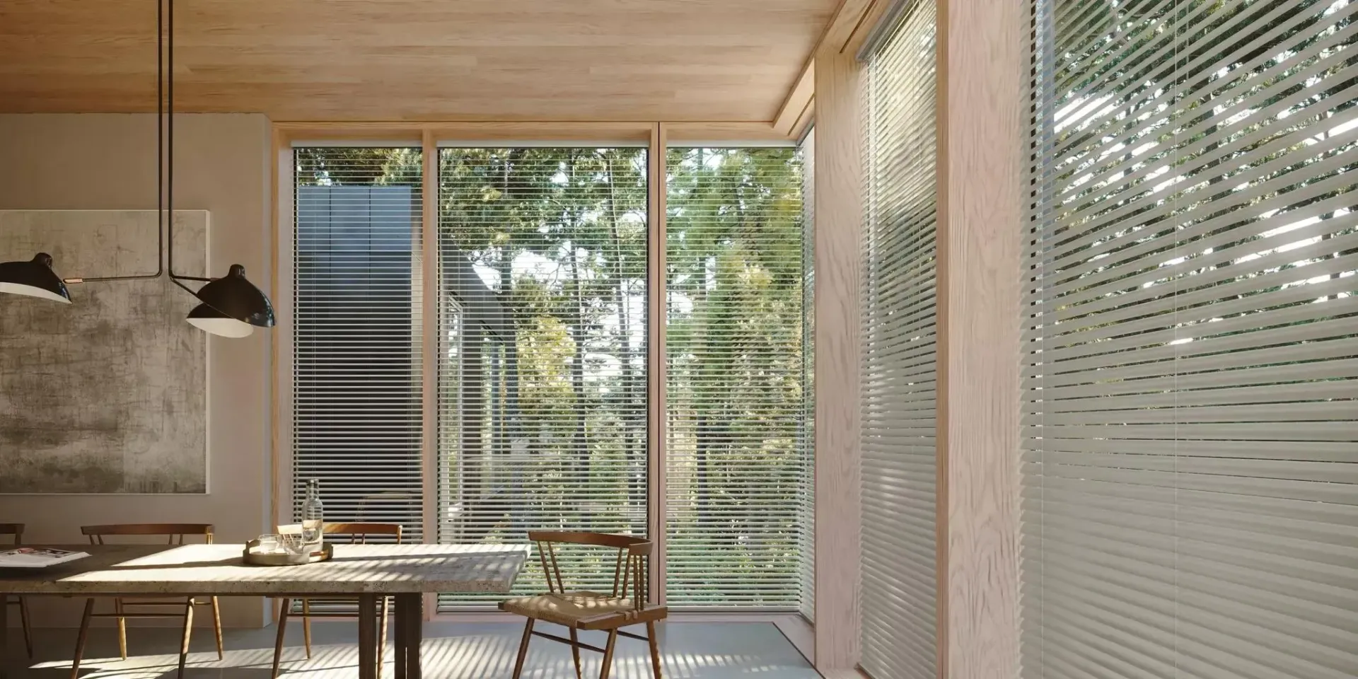 Dining room with table, chairs, large windows, and an outdoor view.
