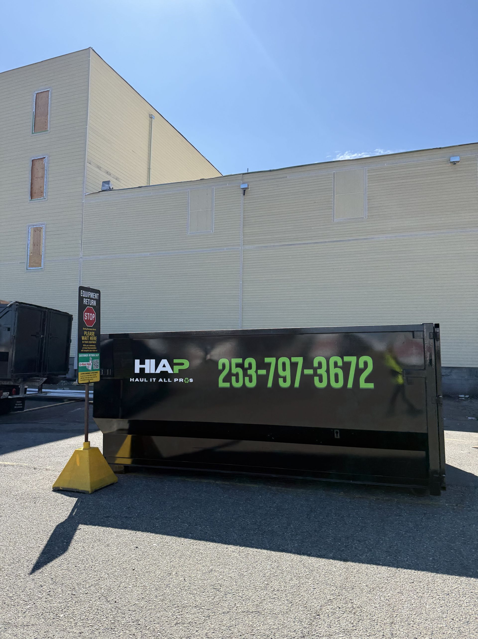 Black dumpster with