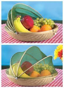A basket filled with fruit is sitting on a table.
