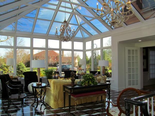 A living room with a large glass ceiling