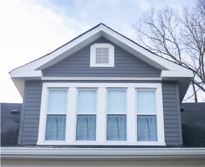 A house with three windows and a roof