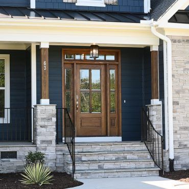 The front door of a house with the number 36 on it