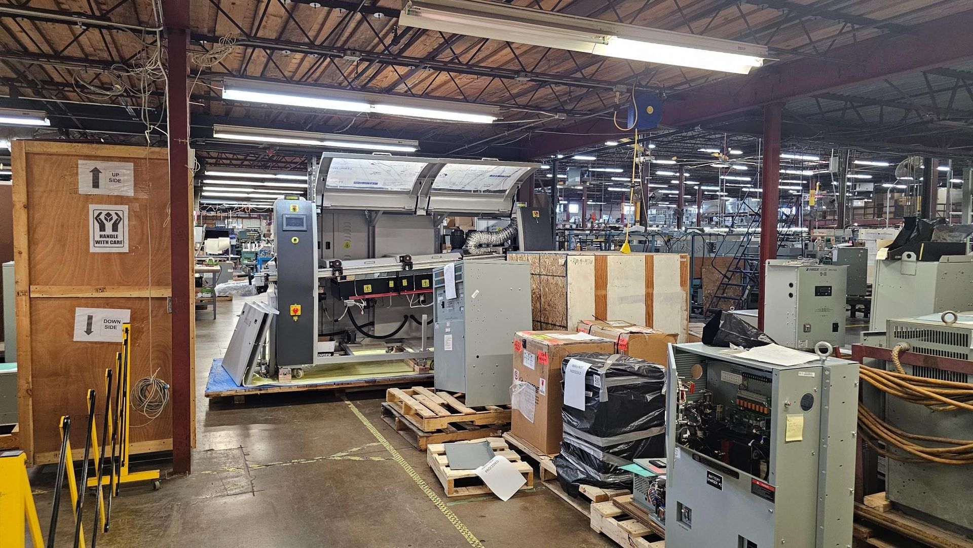 A large warehouse filled with lots of equipment and boxes.