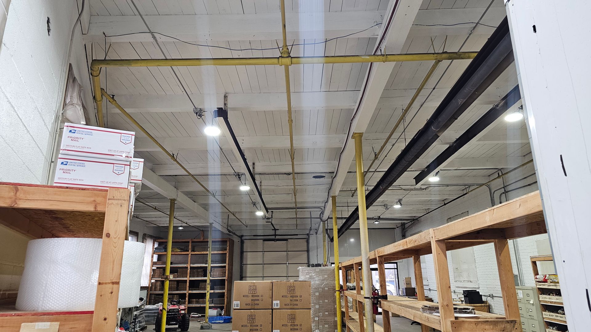 A large warehouse filled with lots of shelves and boxes.