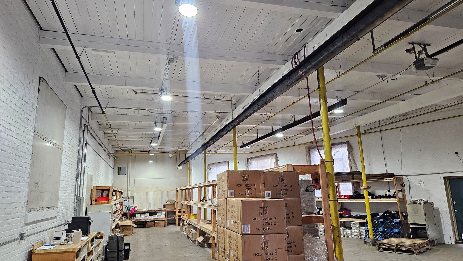A large warehouse filled with lots of boxes and shelves.