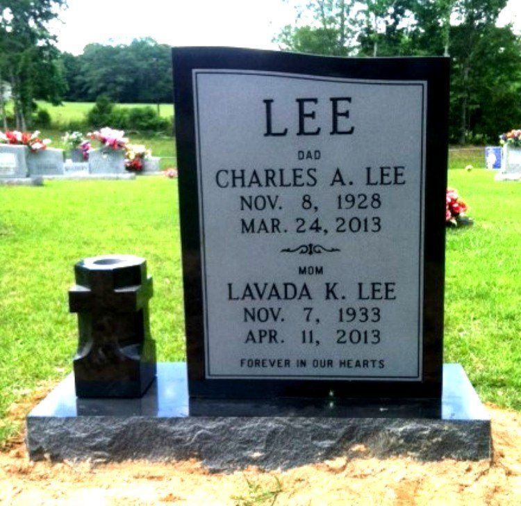 A gravestone for charles a lee sits in a cemetery