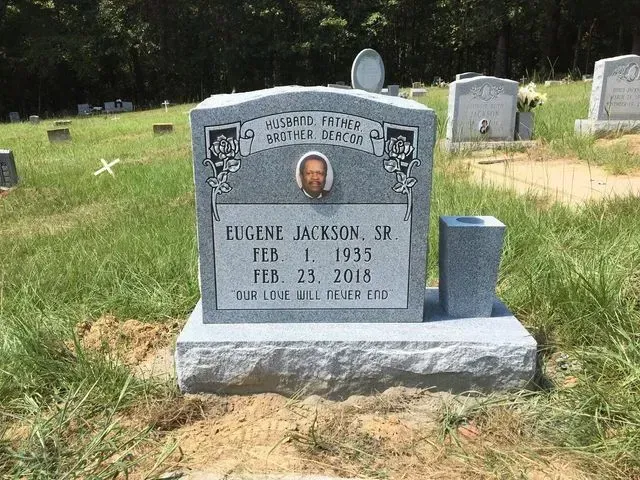 A Gravestone in a Cemetery with a Picture of a Man – Canton, MS – Davidson Marble & Granite