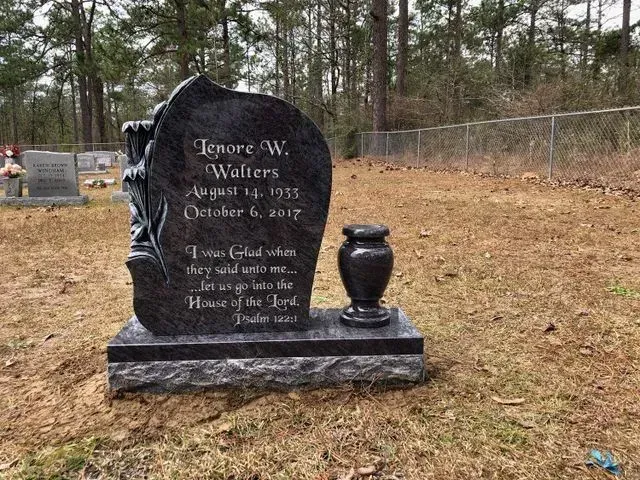 A Black Gravestone with a Vase in a Cemetery – Canton, MS – Davidson Marble & Granite