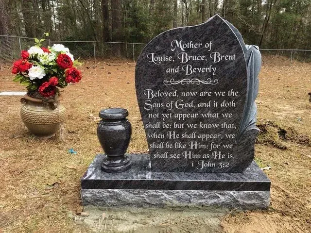 A Gravestone with a Vase of Flowers – Canton, MS – Davidson Marble & Granite