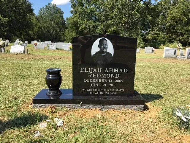A Gravestone for Elijah Ahmad Redmond in a Cemetery – Canton, MS – Davidson Marble & Granite