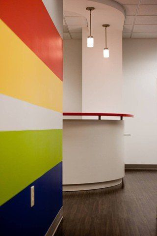 multi colored wall with desk