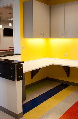 desk with yellow accent wall