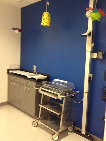 weight scales with blue wall