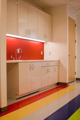 sink area with red wall