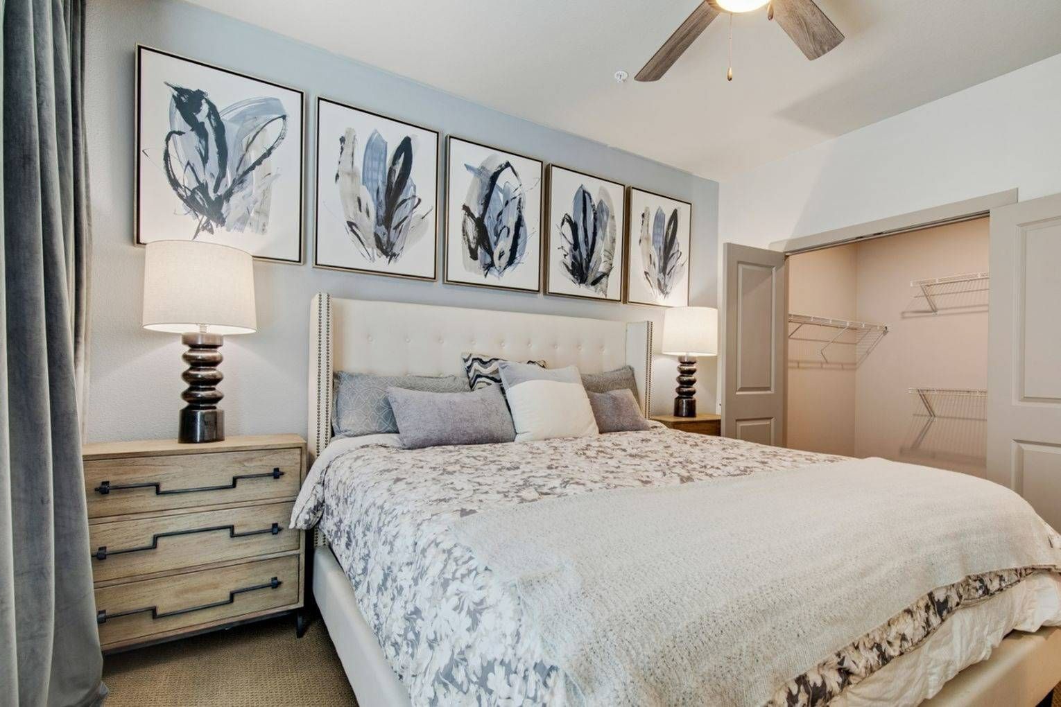 A bedroom with a large bed and a ceiling fan at Avail Modern living CO.