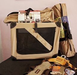 A tan and black bag is sitting on a table