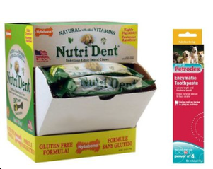 A box of nutri dent is next to a bottle of fresh breath