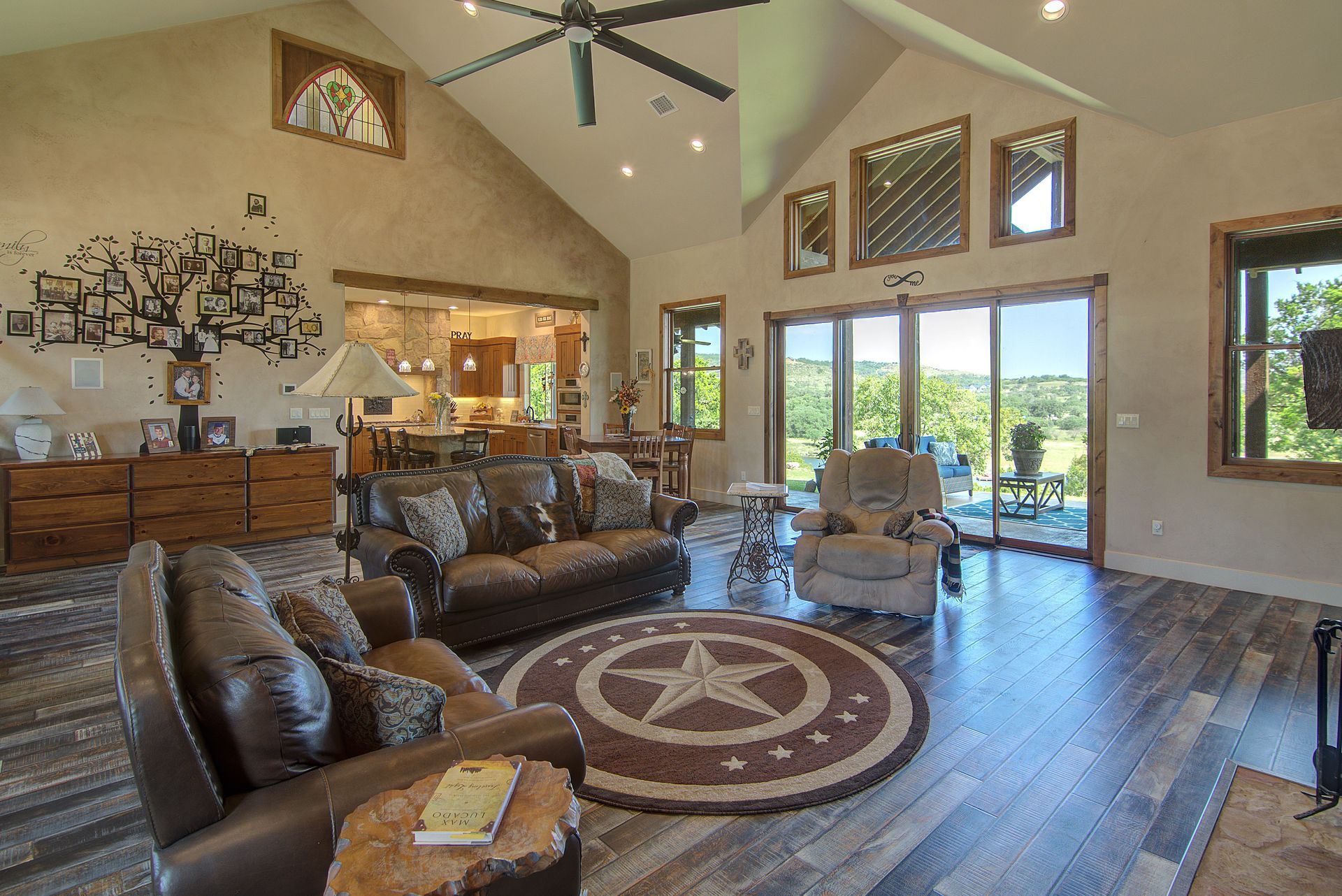 A living room filled with furniture and a ceiling fan.