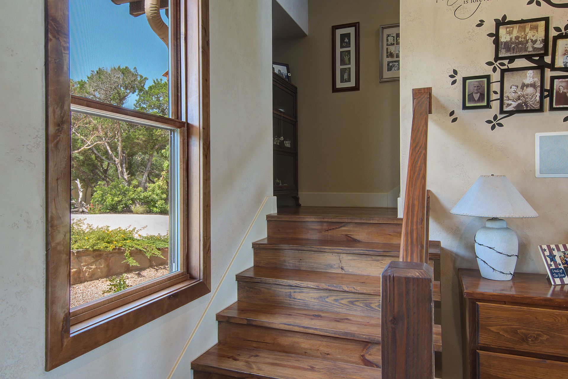 A wooden staircase leading up to the second floor of a house