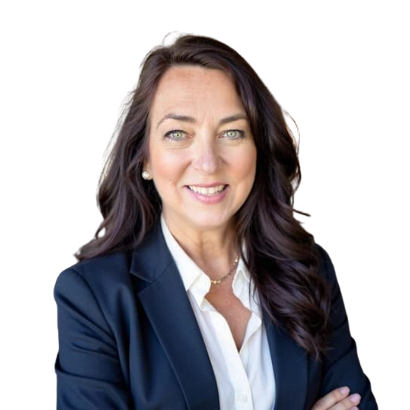 Woman in beige blazer seated and smiling against a white background.