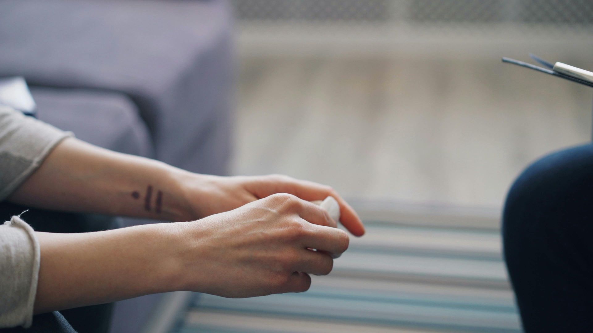 hands of people in a therapy session