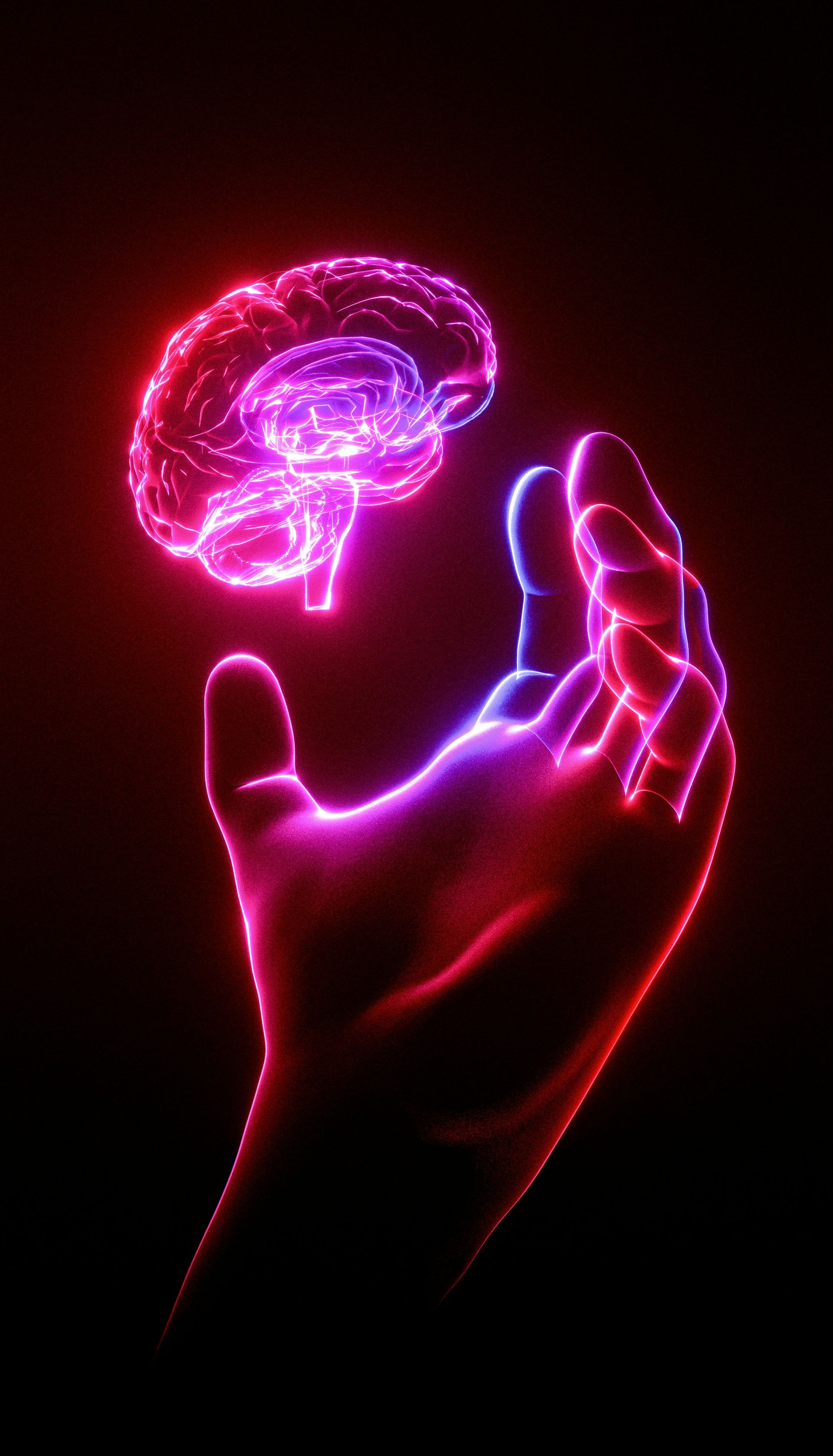 Glowing neon pink hand reaching toward a floating brain on a black background