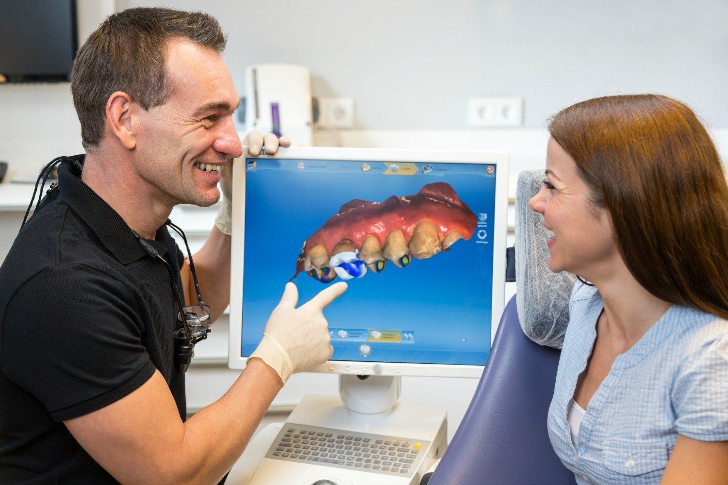 Dentist explaining the CEREC process.