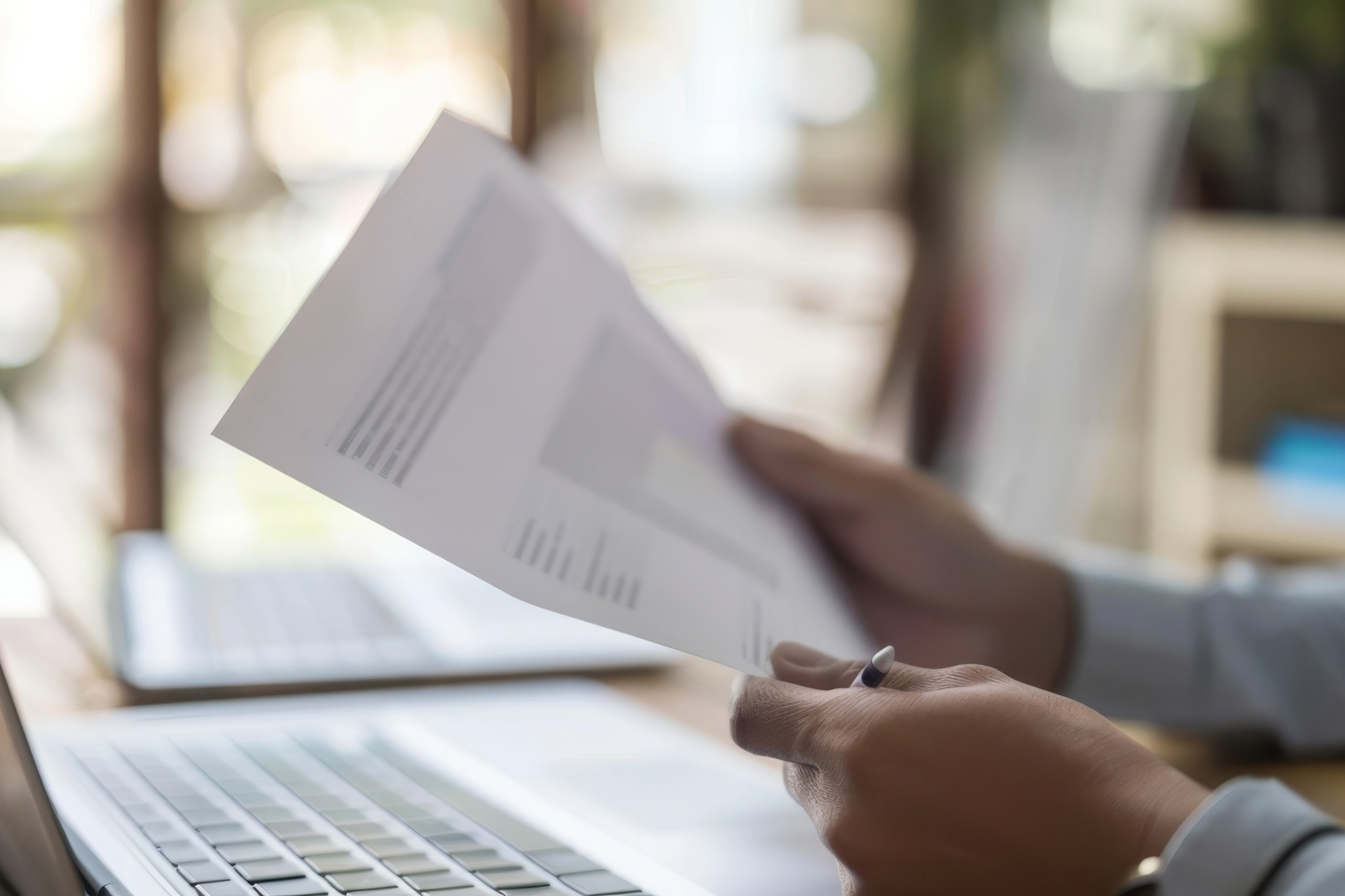A man is giving a piece of paper to a woman.
