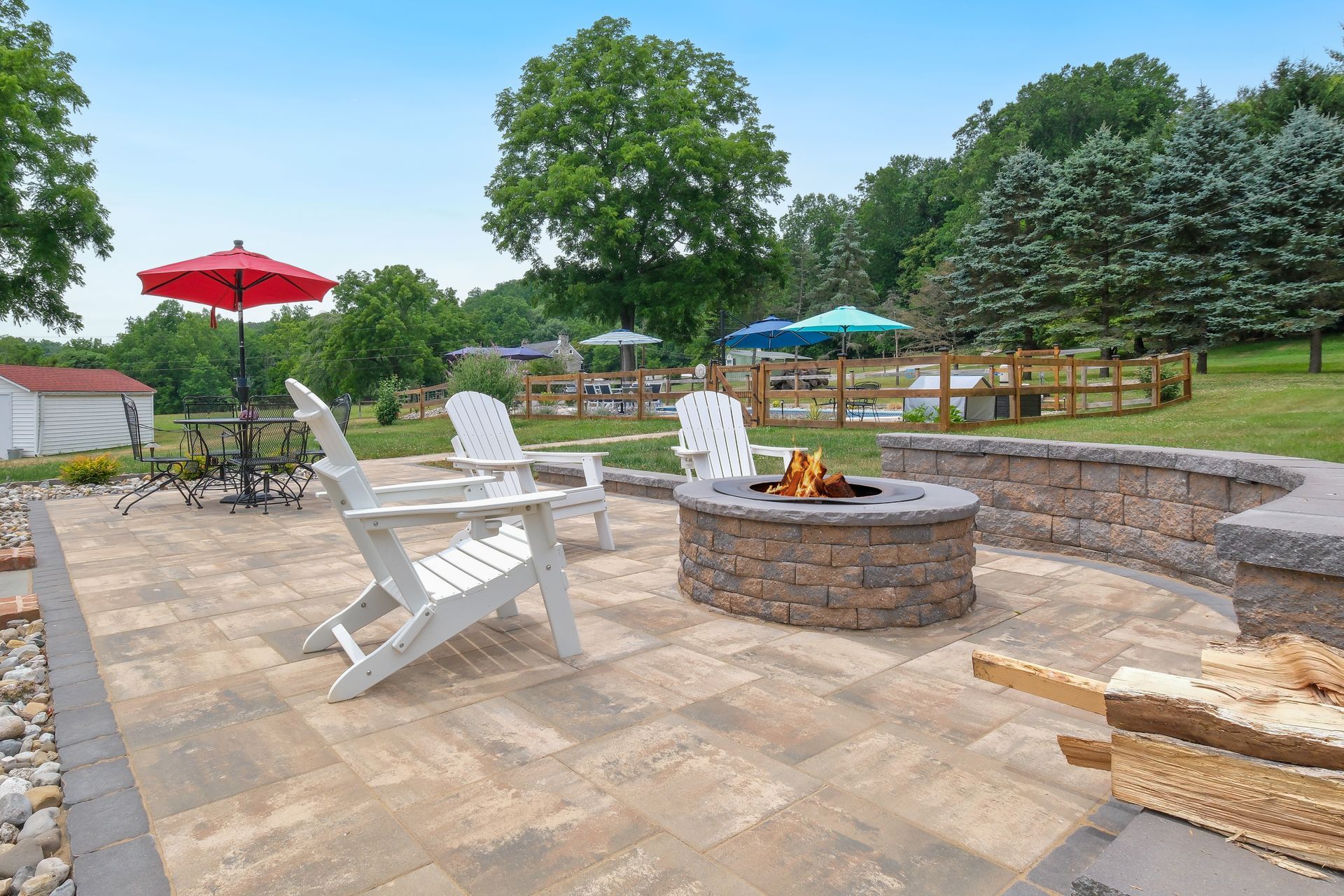 Flag Stone Patio in Bel Air, MD with a Outdoor Fireplace and Retaining Wall or Sitting Wall