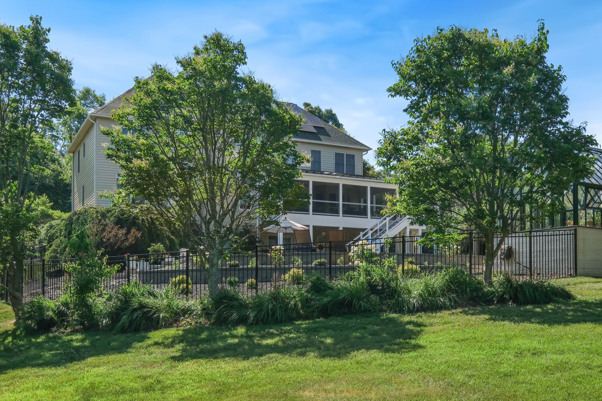 Backyard featuring a pool, patio, and multi-level deck for outdoor living