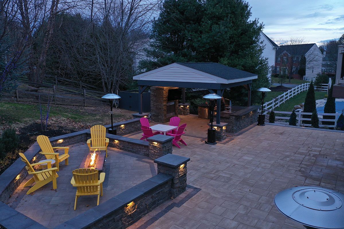 There is a fire pit in the middle of the patio.