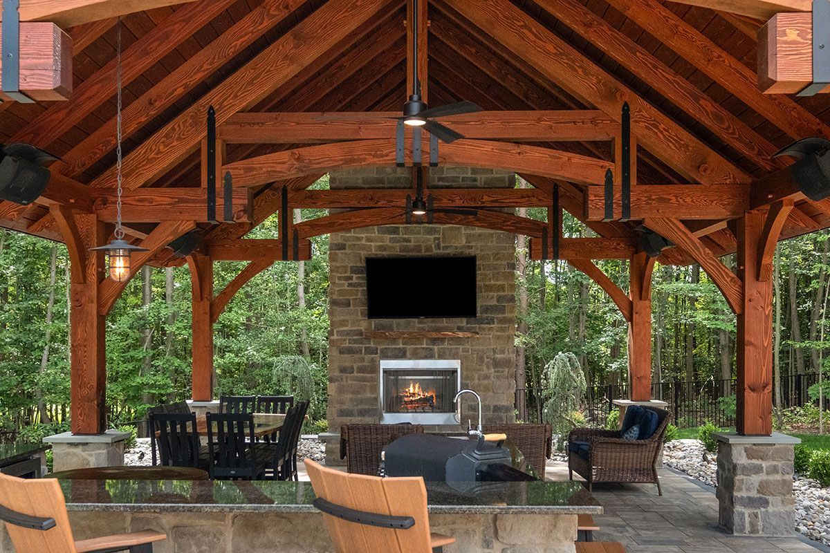 There is a fireplace in the middle of the pavilion.