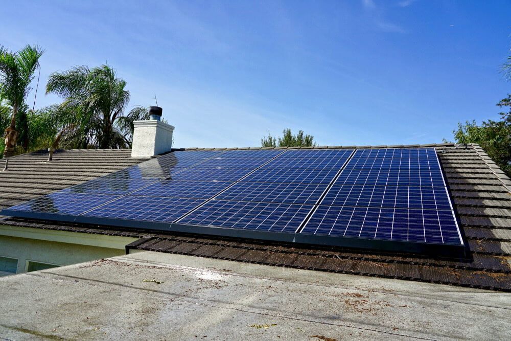 There Are Many Solar Panels On The Roof Of A House — Central West Budget Tree Services in Dubbo, NSW
